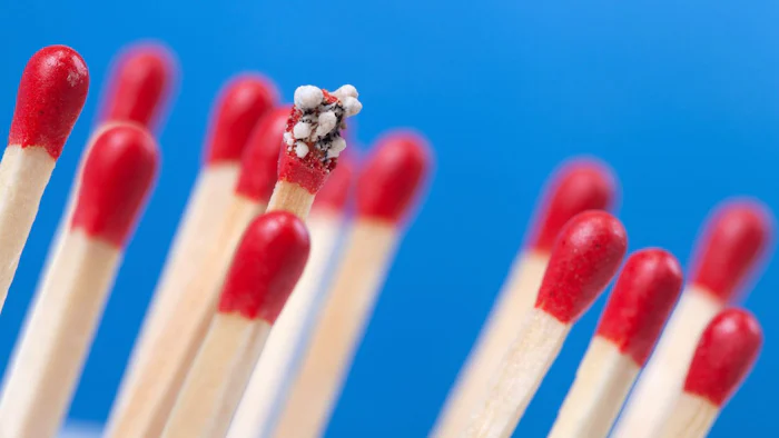 Close up of matchsticks, one of which is spent.
