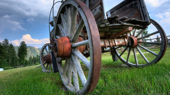 Close up of a wooden wagon wheel.